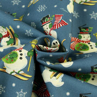 輸入プリント生地 ブルー地 クリスマス遊ぶスノーマン 巾110cm×3mカット販売 10370-peacock（直送品）
