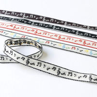 日本紐釦貿易 チロルテープ 音符 5m巻 巾約11mm DAI144-42-1-5M 1セット(5m巻)（直送品）