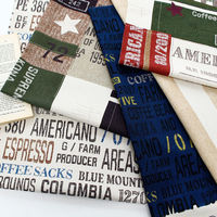 日本紐釦貿易(Nippon Chuko) キャンバス生地 CRAFT VILLAGE パッチワーク風 ブラック系 巾約110cm×8mカット（直送品）